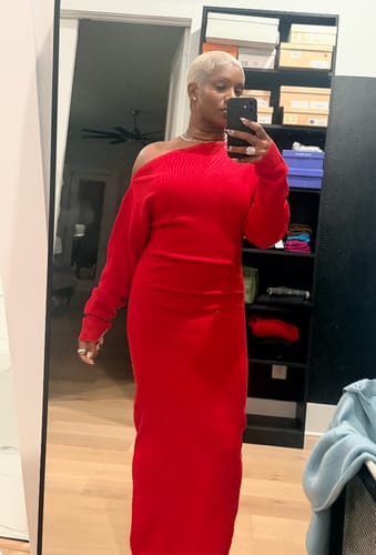 Reviewer taking a mirror selfie while wearing the red Knit Off-Shoulder Sweater Maxi Dress.