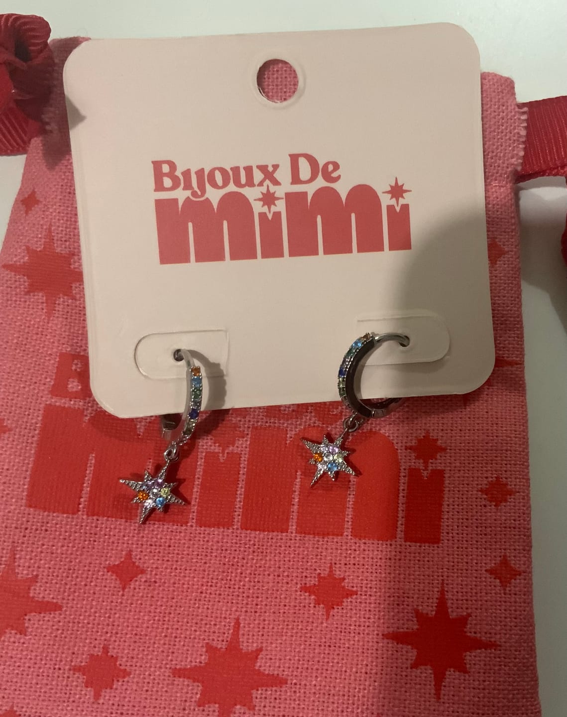 Customer photo review of Cosima Rainbow Silver Star Huggie Earrings