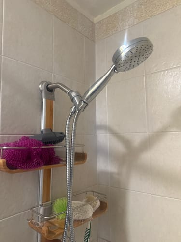 Customer's metal Handheld Shower Head Set installed and mounted in a tiled shower stall.