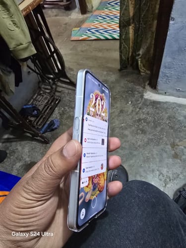 Customer holds a Nothing (PH 2) phone, showing a side view of the clear transparent case.
