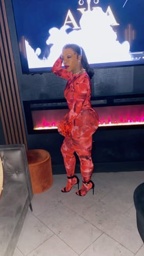 Customer showing a side view of the form-fitting Bare Body Boatneck Bodysuit and matching bottoms.