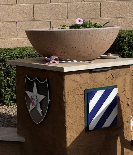 Customer's US Army 2nd Infantry Patch metal art mounted on an outdoor pillar next to a 3rd Infantry Division patch.