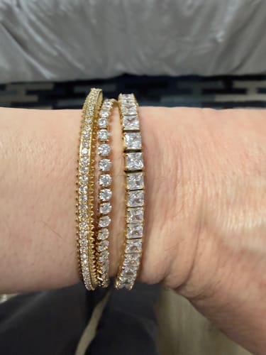 Customer showing the Luxe Tennis Bracelet with bold stones as part of a sparkling bracelet stack on their wrist.