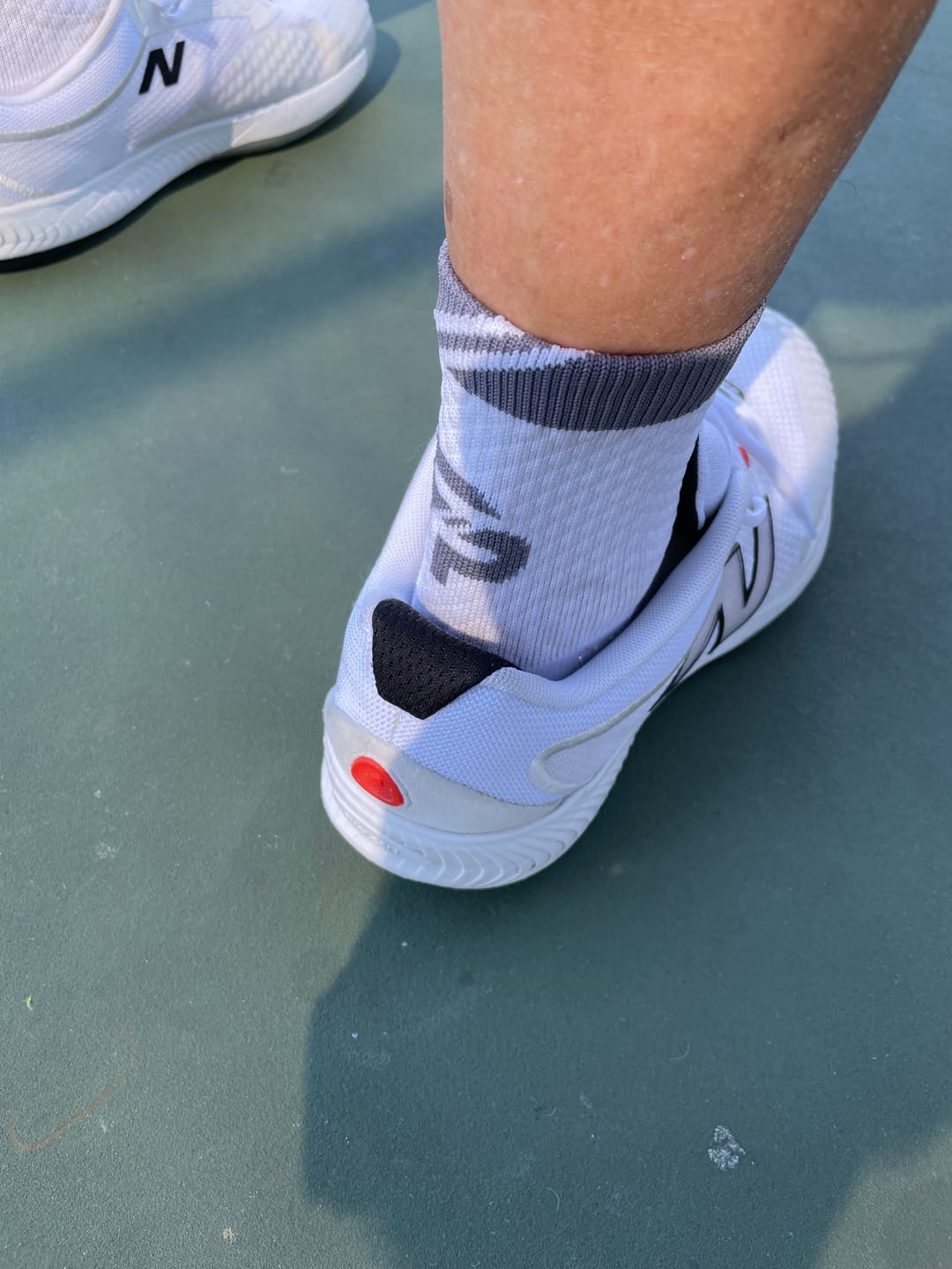Customer photo review of 4 Pack Black and White Combo ULTRAGRIP V2 Dual sided Non-slip Technology Socks