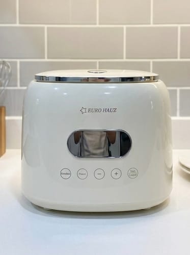 Customer's sleek white Eurohauz Healthy Rice Cooker on a kitchen counter in front of a tiled wall.