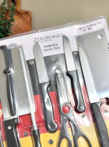 Customer shows the free 8-piece knife set from the Eurohauz Healthy Rice Cooker, still in its packaging.