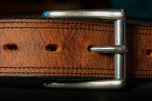 Customer's close-up of the rugged Montana Bison Double Layer belt, showing the brown textured leather and steel buckle.