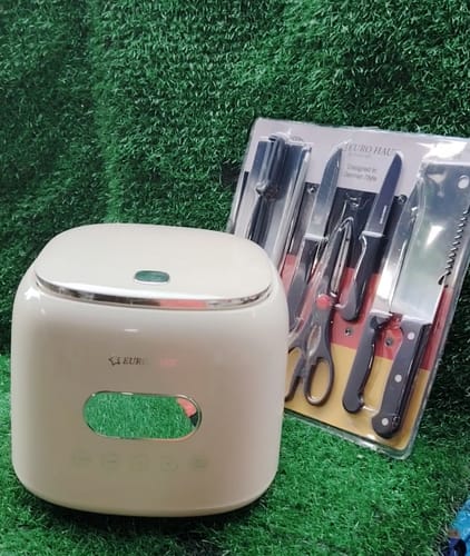 Customer's cream-colored Eurohauz Healthy Rice Cooker shown with the free 8-piece knife set on a green surface.