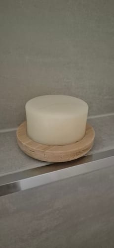 Customer's round Coconut Conditioner Bar on a bamboo drainer dish.