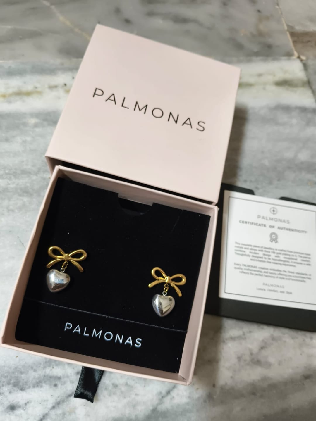 Customer photo review of Bi-metal Wrapped With Love Heart Earrings