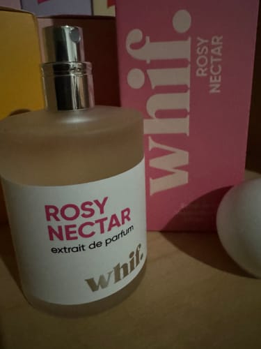 Customer's Rosy Nectar perfume bottle shown next to its pink box.