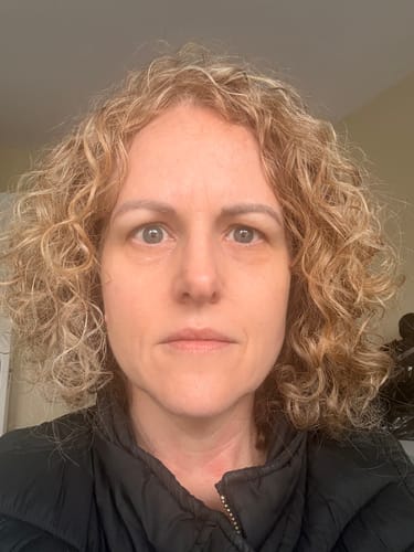 Reviewer's close-up photo showing smooth, hydrated skin after using Glow to Bed cream.