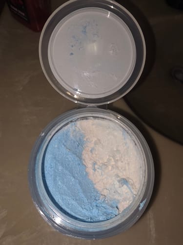 Customer's open jar of Dead Winter Split Scrub, showing the blue and white scrub inside.