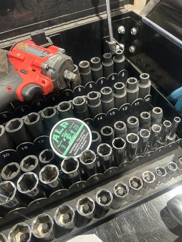 Customer's can of Refreshing Chill Nicotine Pouches in a toolbox drawer among various sockets.