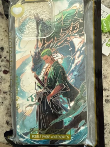 Customer's Roronoa Zoro - One Piece phone case in its original packaging, showing the detailed anime artwork.