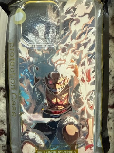 A customer's new Monkey D. Luffy phone case in its clear packaging, showcasing the detailed anime artwork.