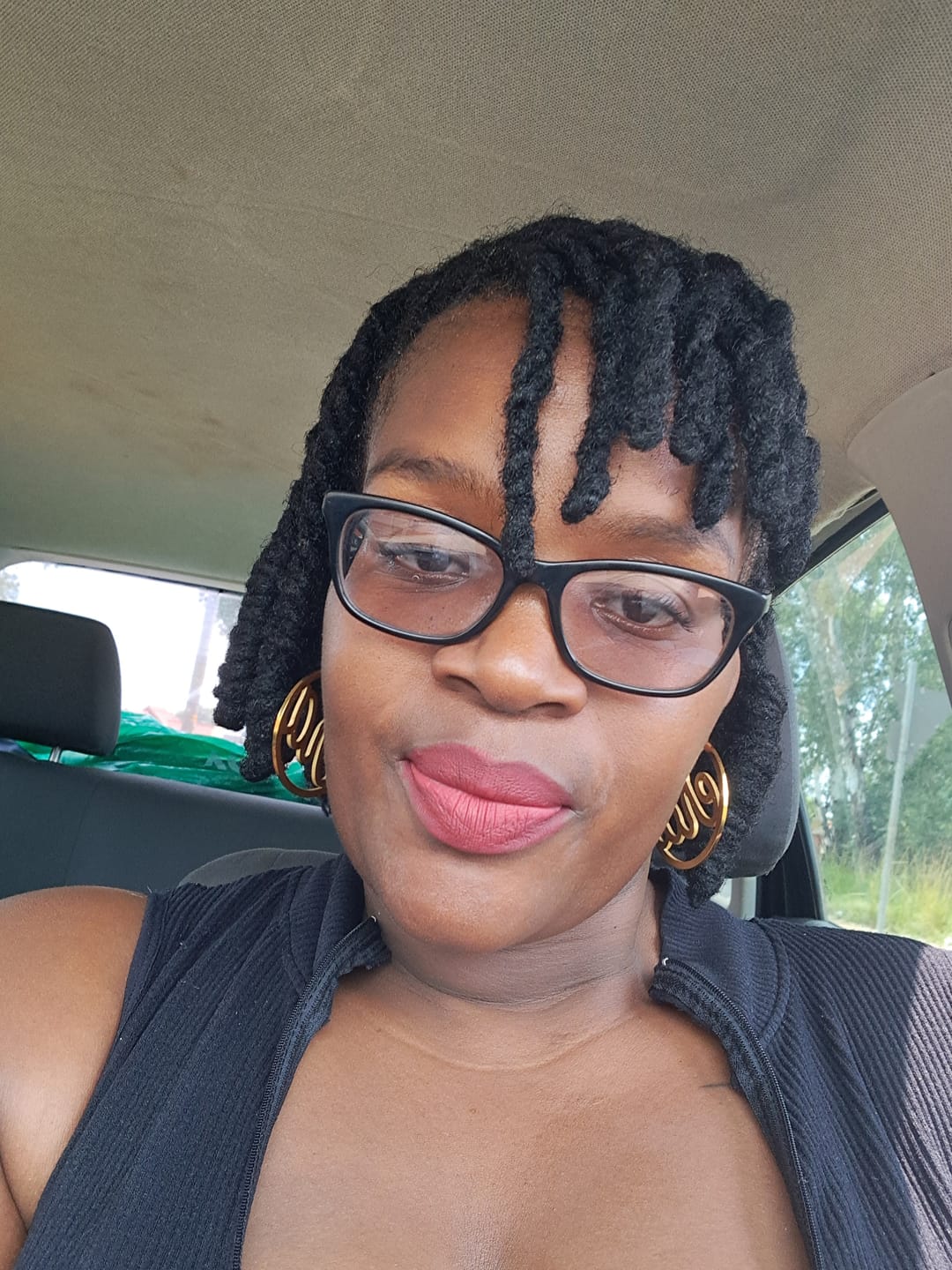Customer photo review of Gold Luxe Logo Hoops