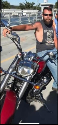 Customer's before photo showing his physique on a motorcycle before using Lean Mass Supercharger - 1-Androl.