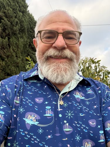 Close-up of a customer wearing the blue Jetsons 'Jet-Setters' All-Day Polo.