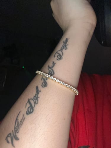 Reviewer's arm wearing the elegant, gold Everyday Tennis Bracelet.