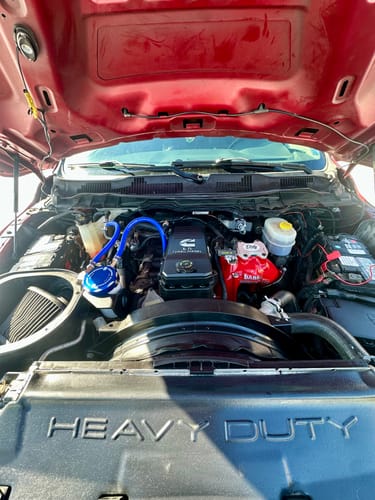 Customer's view of the installed red Monster-Ram Intake in their Cummins engine bay.