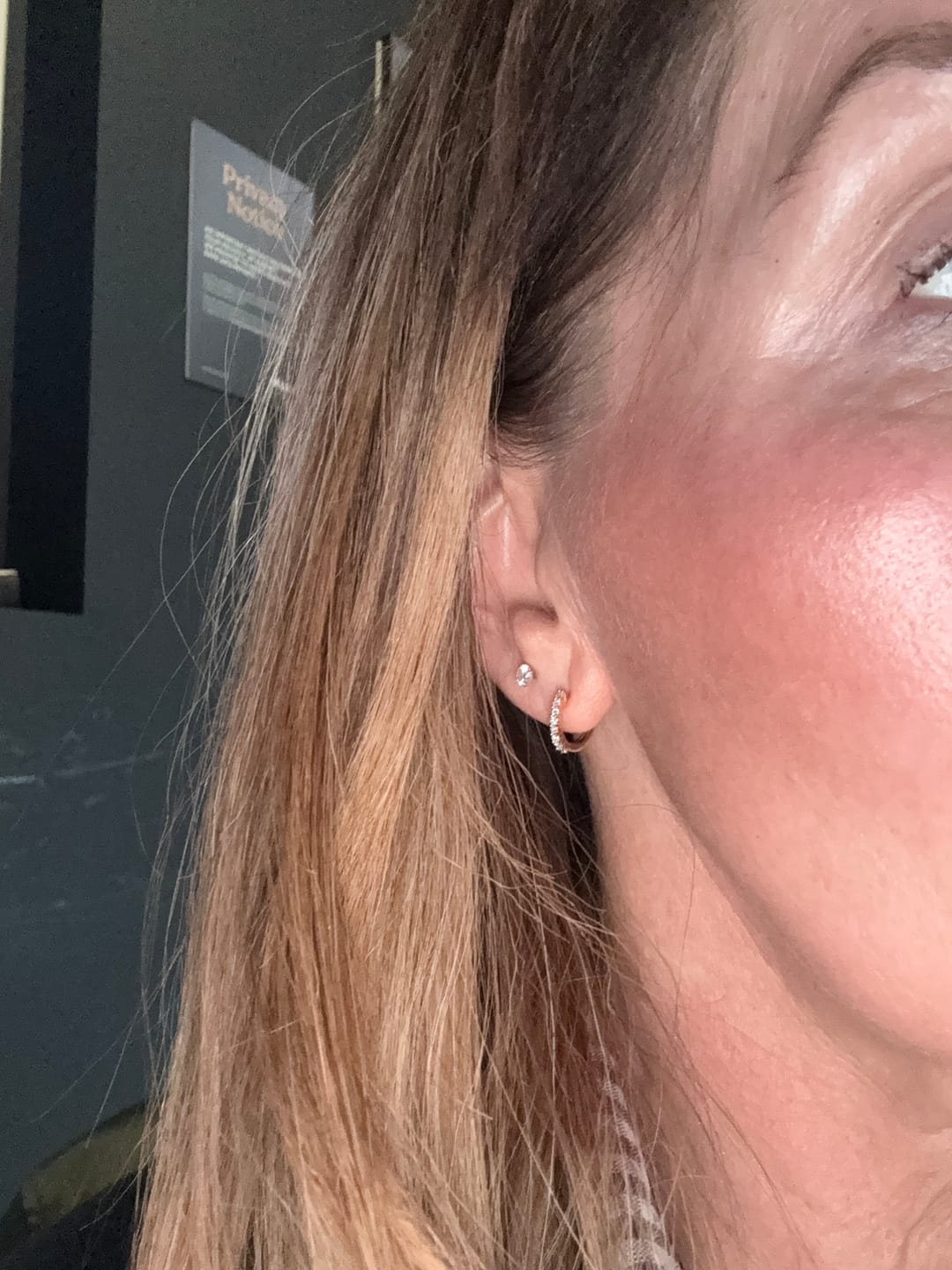 Customer photo review of Versa Single Spark Lab Grown Diamond Huggies Hoop Earrings
