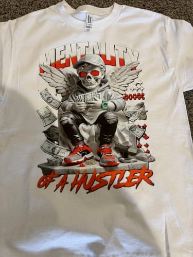 Customer's white t-shirt with a complex graphic printed using the DTF Ink Set, showing vibrant colors.