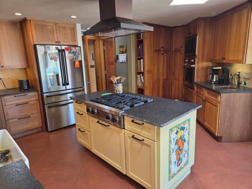 Customer's yellow kitchen island showing the smooth matte finish after applying the Matte Sealer.