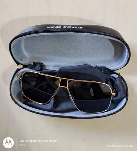 Customer's golden-framed Wayfarer sunglasses resting inside their open black case with a cleaning cloth.