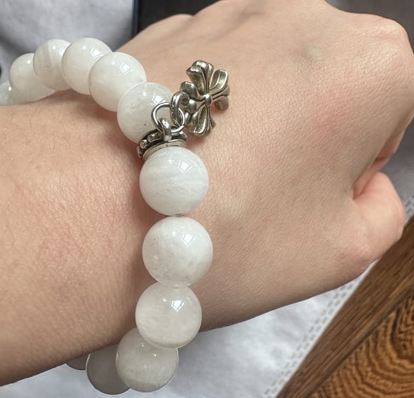 Customer photo review of Hvibetune "Divine Growth" White Phantom Quartz Cross Bracelet