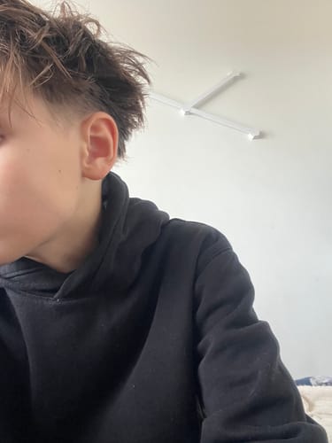 Reviewer showing their textured hairstyle after using the Hair Clay.