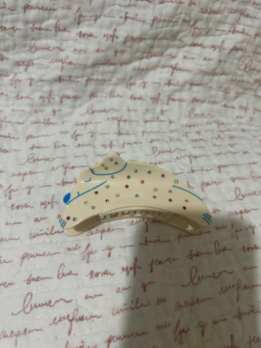 Customer photo review of Acrylic White Puppy Hair Claw Clip Colorful Rhinestones – Medium