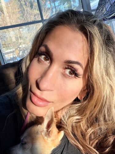 Reviewer's close-up selfie showing her long, full eyelashes in the sunlight.