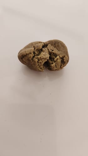 Customer's Golden Mousse broken open, showing its soft, crumbly interior texture.