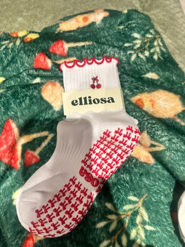 Customer's 'I'm Just A Girl' sock with a grippy red sole and a cherry on the cuff.