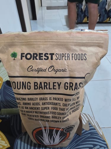 Customer's large paper bag of Forest Super Foods Certified Organic Young Barley Grass.