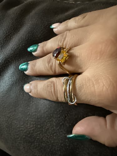 Reviewer's hand wearing the elegant Alinity Ring, showing its mixed-metal double-band design.