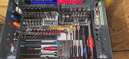 Reviewer's tool drawer with many sockets and tools neatly organized using Toolgrid Socket Holder Clips.