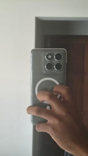 Customer holding their Motorola Edge 60 Pro in the clear Anti Yellow Magsafe Case, showing the back of the phone.