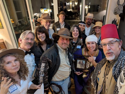 A group of reviewers in costume posing together while playing the Ancient Egypt Murder Mystery Game.