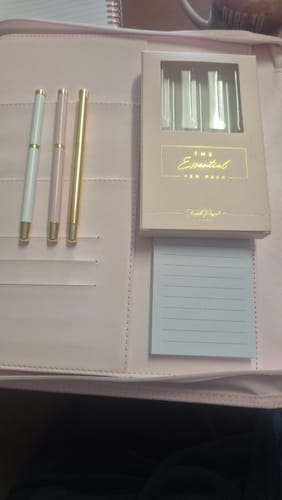 Customer's Essential Pen Pack unboxed, with the three pretty pens and their packaging displayed inside a pink folder.