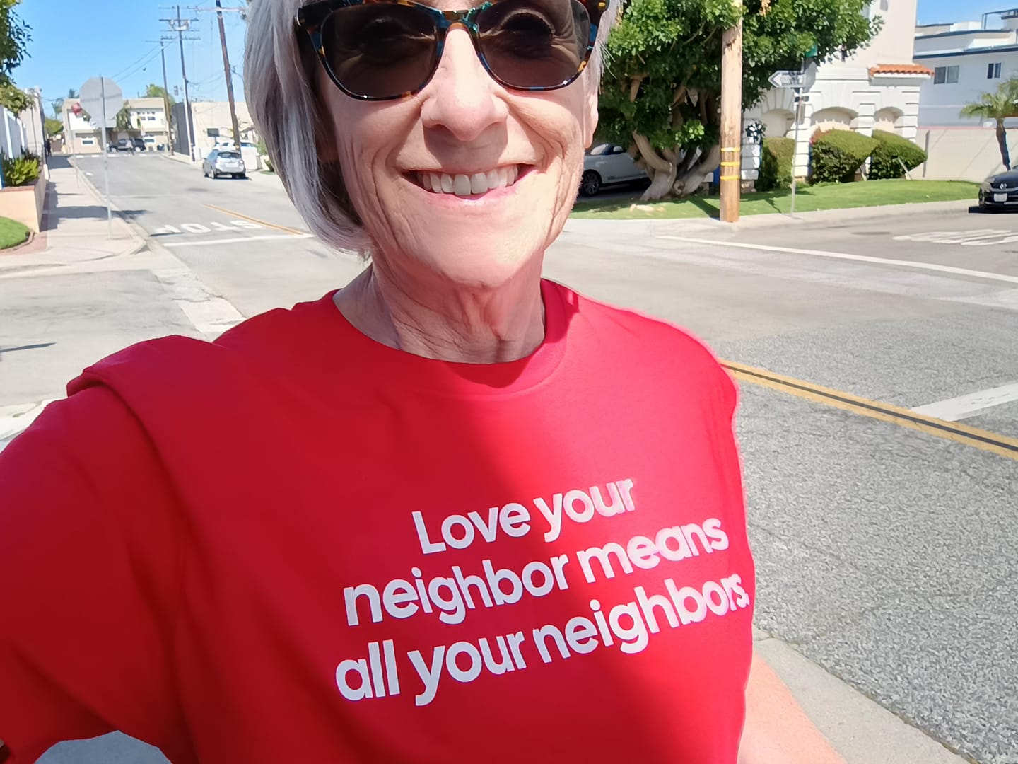 Customer photo review of Love Your Neighbor Means All Your Neighbors Unisex Tee