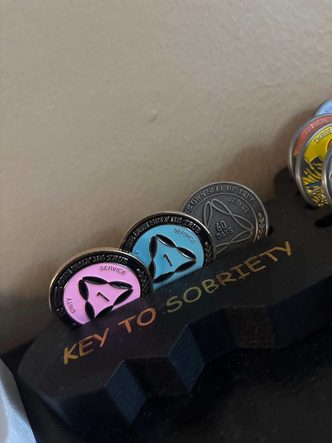 Customer photo review of 1 to 50 Year Bronze AA Meeting Chips - Sobriety Mint Infinity Triangle Recovery Medallions/Coins