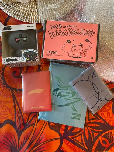 Customer's items from the K-POP RANDOM BOX, including Ateez albums, a plush figure, and a Wooyoung box.