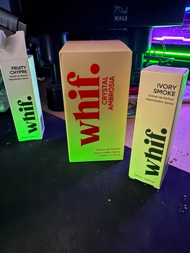 Customer's Ivory Smoke fragrance box on a desk alongside other scents from the brand.