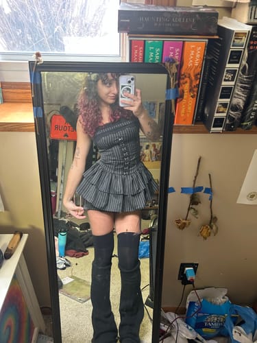 Reviewer's mirror selfie showing the front of the pinstriped Grunge Doll Stripes Flared Romper Dress.