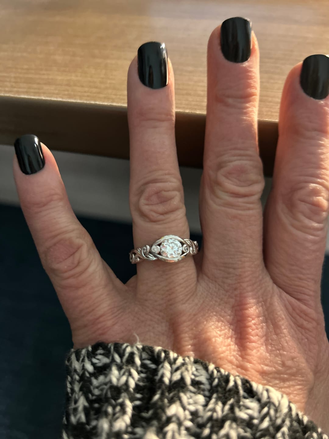 Customer photo review of Bezel Set Round Moissanite Scroll Accents Engagement Ring