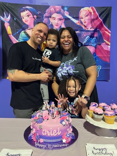 Reviewer wearing a black t-shirt from the LGND89 Mystery CASH Box in a family photo.