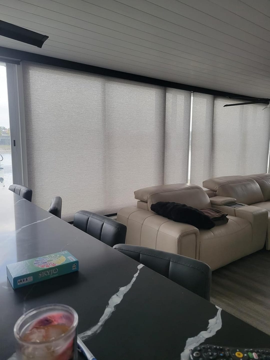 Customer photo review of Bringnox Motorized Light Filtering Roller Shades 70% Blackout Essential