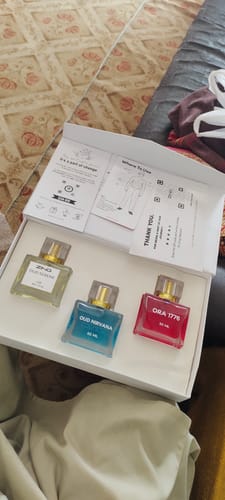 Customer's open OUD Supreme BUNDLE box, showing the Nirvana, Serene, and Ora 1776 fragrance bottles.